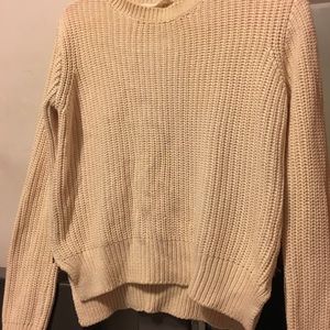 Long sleeve cream pullover sweater.